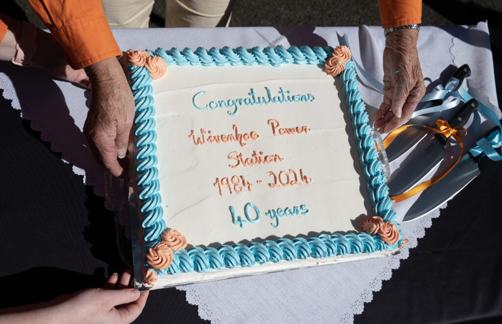 A close-up photo of a large cake. The cake reads "Congratulations. Wivenhoe Power Station. 1984 - 2024. 40 years."