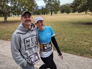 A CleanCo employee and her partner smile as they walk in the Park2Park event